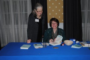 Kathy Erskine signs "Mockingbird" for RIF's Carol Rasco.